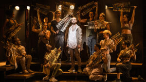 A modern depiction of entering into Jerusulem with Jack Hopewell as Jesus Christ, and the company of the North American Tour of Jesus Christ Superstar.